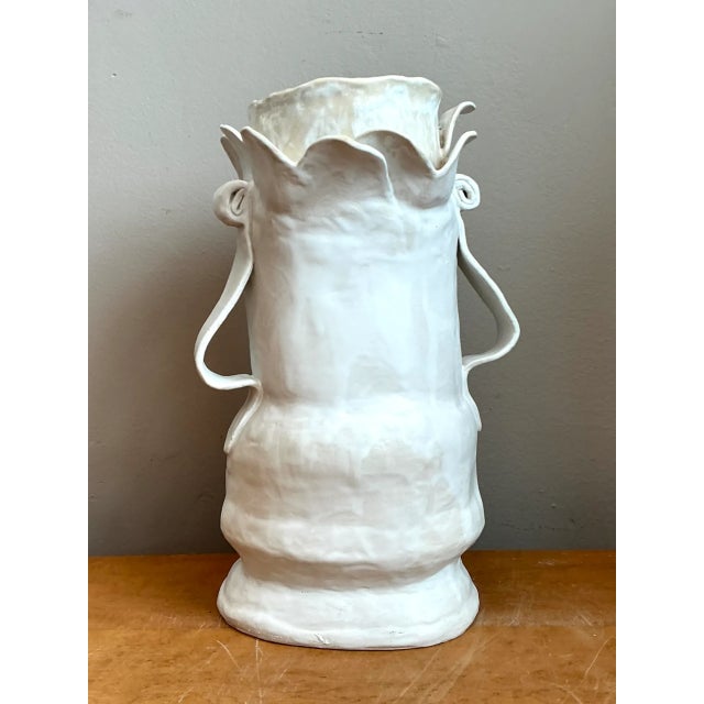 Exuding expressive studio craftsmanship and fluid organic form, this vintage biomorphic ceramic vase makes a commanding...
