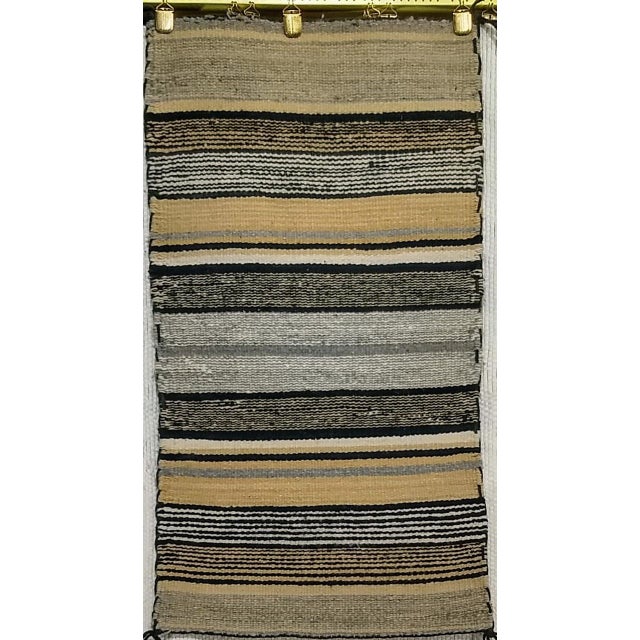 A beautifully preserved example of mid-20th century Navajo weaving, this vintage Native American rug originates from the...