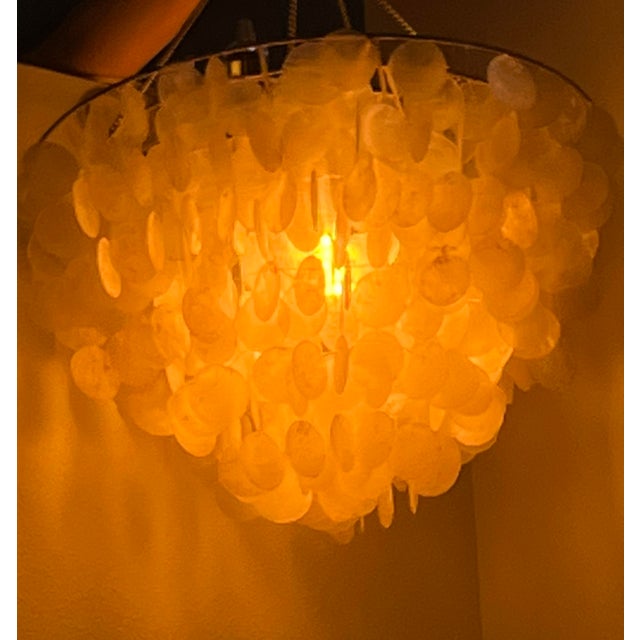 If this wasn’t a chandelier I’d hang it outside just to listen to the tinkling sounds of the shells as they brush...