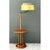 This vintage floor lamp is a tall, sculptural composition that unites lighting and a built-in side table in one slender...