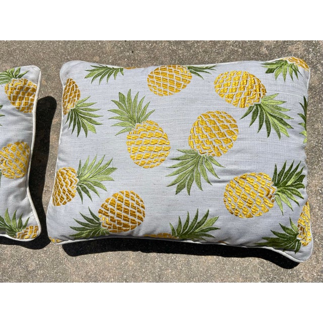Pair of 2 tropical-themed decorative throw pillow featuring a textured, repeating embroidered pineapple pattern. Bright...