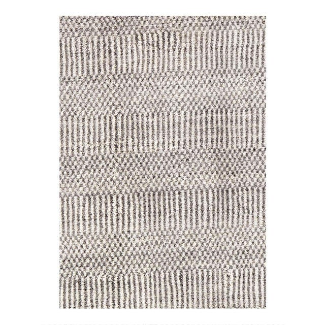 The Savannah Collection includes area rugs, It emphasizes borderless, subtly colored pieces either in monochrome or tone-...