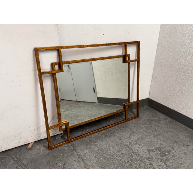 Design Plus Gallery presents a Vintage Maison Jansen Style Geometric Wall Mirror. This rectangular wall mirror shows the...
