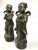 This pair of carved brass boy and girl are from China. They have been lovingly stored away for decades. A bit of tarnish...