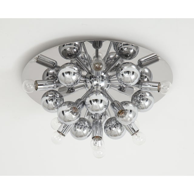 Pair of 1970s chrome sputnik lights by Cosack Leuchten. This stunning pair of lights can be used as wall sconces or flush...