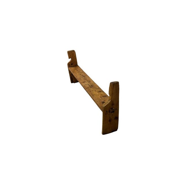 A beautiful antique bench made of fir wood, characterized by an extremely simple and primitive style, with essential and...