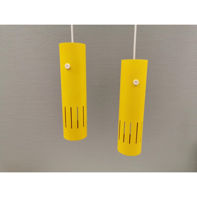 A set of beautiful trombone hanging lamps, refurbished and repainted in beautiful yellow colours. Originally produced by...