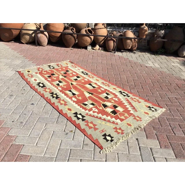 This beautiful, vintage, handwoven kilim is approximately 60 years old. It is handmade, of very fine quality hand spun...