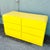 This striking Postmodern waterfall dresser makes a bold statement with its high-gloss canary yellow laminate finish and...