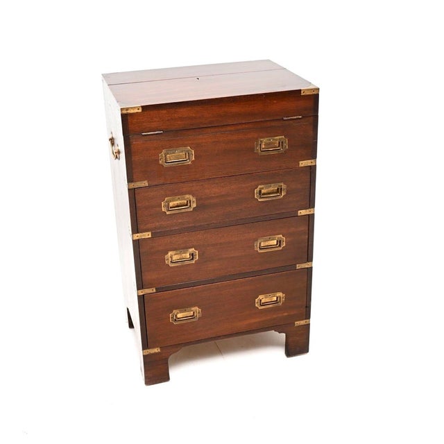 A smart and very unusual antique military campaign style bureau chest of drawers. This was made in England, it dates from...