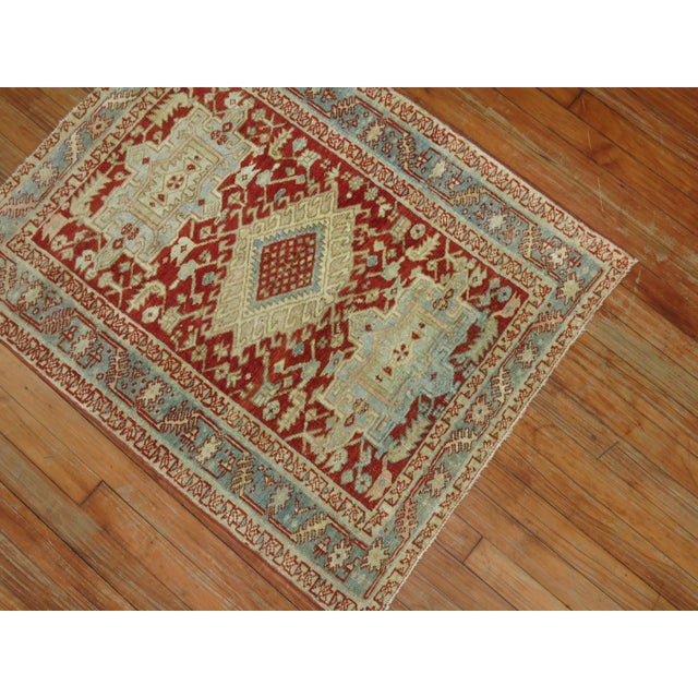 A colorful traditional oriental Persian Heriz Scatter size rug from the 1920s. Measures: 2'9" x 3'5".