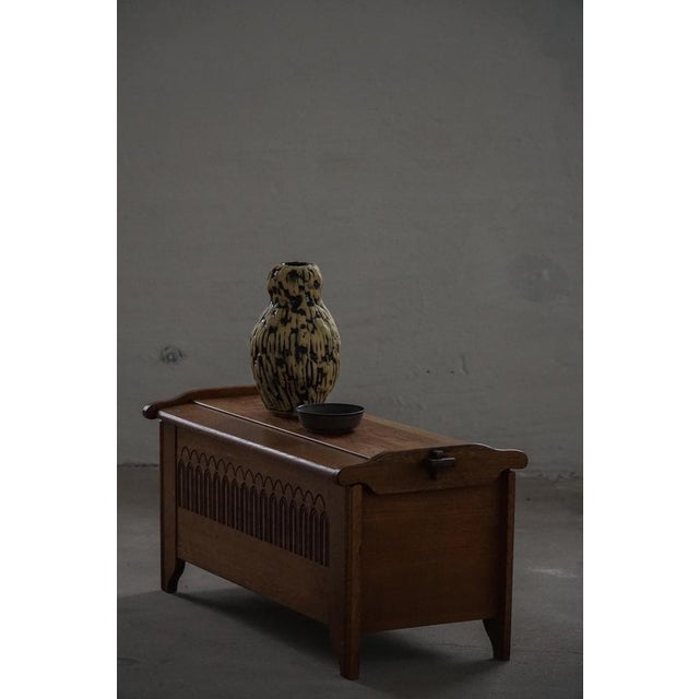 This exceptional chest is a fine example of traditional Danish woodworking, executed in solid oak with richly detailed...