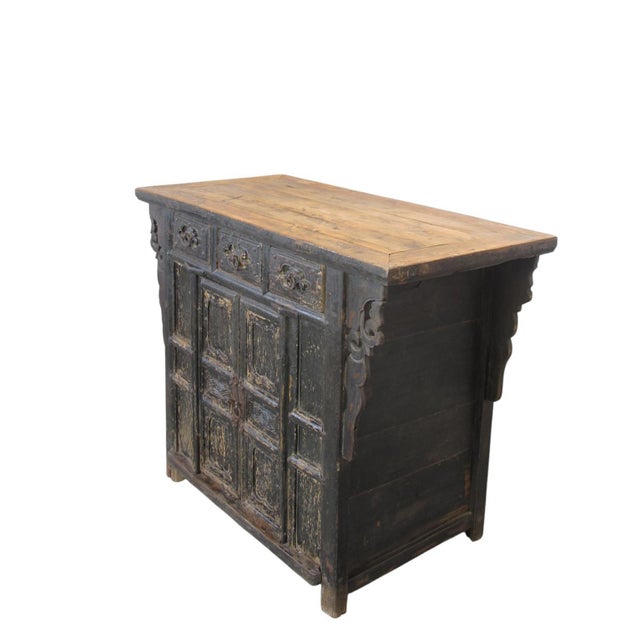 This 18th century antique elm coffer features a silhouette characterized by three upper drawers and a spacious two-door...