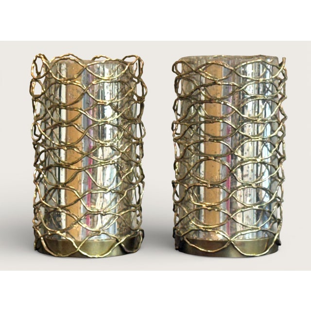 A pair of lovely John-Richard Woven Brass candle holders with silvered glass liners. Excellent condition. Measurements:...