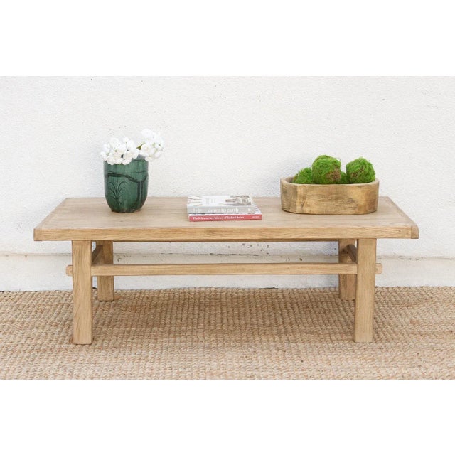 This gorgeous reclaimed wood coffee table is a perfect blend of rustic character and clean, minimalist lines. Measuring a...