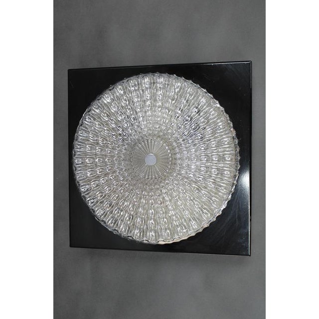 A refined mid-century ceiling or wall light designed and produced by lidokov in czechoslovakia during the 1970s. The...