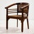 Art Deco style armchair with rattan seat and backrest and exciting details. The surface of the chair has scratches,...