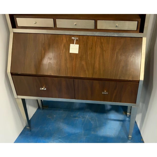 Original retail $7400, Stylish Caracole modern secretariat desk, mahogany finished wood frame with silver leaf trim and...