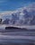 This artwork presents a striking figure painted in vibrant shades of blue, set against a dramatic sky filled with...