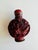 Vintage Carved Cinnabar Snuff Bottle with Qianlong Reign Mark A beautifully carved vintage cinnabar snuff bottle featuring...