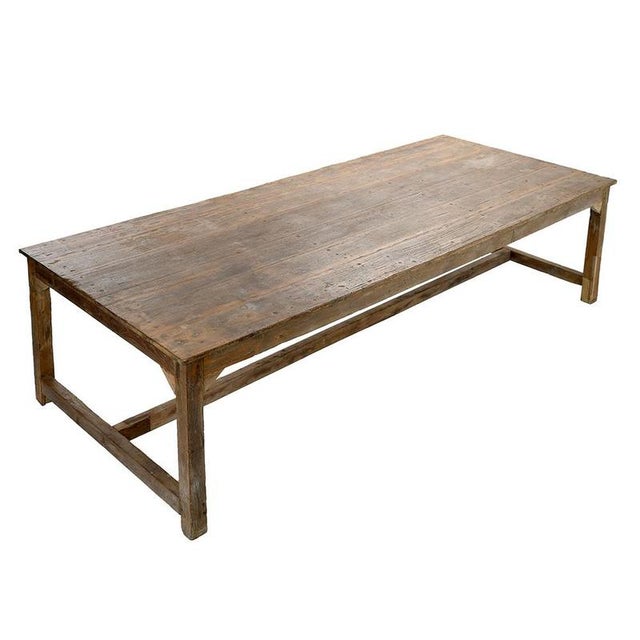 This majestic antique solid wood table captivates with its generous proportions and the authenticity of its patina....