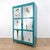 Vintage Industrial style metal wardrobe with a striking turquoise finish and aged mirror panels on the front of the double...