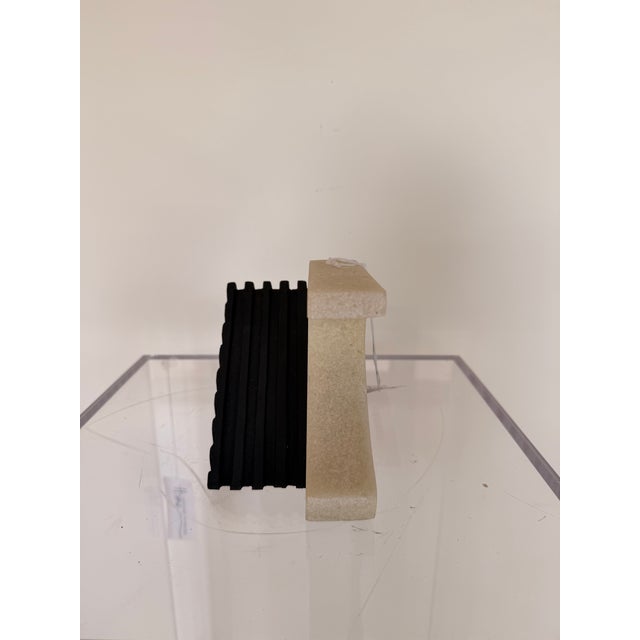 Make a sophisticated statement on your bookshelf with this contemporary sculptural bookend. Featuring a striking...
