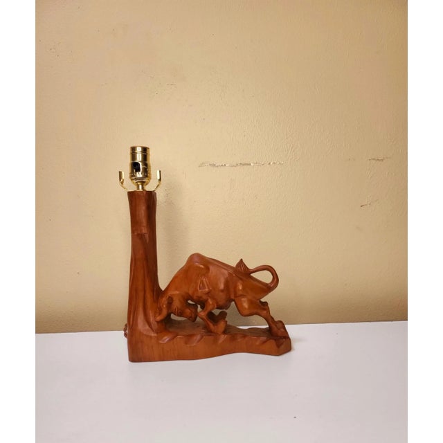 This folk art bull envelopes skill and talent from the artist. The wooden details are smooth and pristine and is topped...