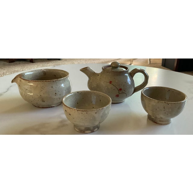 It has a very cute cherry design on a simple-looking ceramic tea set. The set includes the teapot, tea water holder, and...