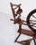 Antique spinning wheel from the 1880s in hand-polished dark wood. — Origin: Europe — Period: Circa 1880s — Material: Dark...