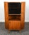 Vintage Danish Modern corner cabinet from the 1960s, featuring richly figured rosewood veneer, clean architectural lines,...