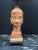 Beautifully carved wooden Buddha head with tribal shade.