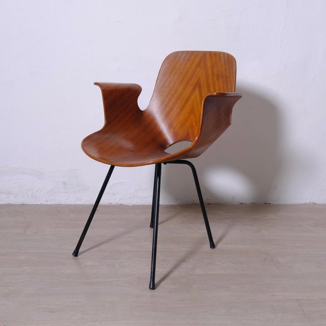 This vintage "Medea" armchair, attributed to Vittorio Nobili for Fratelli Tagliabue in the 1950s, represents one of the...