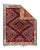 A pile nomadic scatter woven exactly in a kilim design with a red fields patterned with small diamonds forming large...
