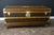 This Vuitton trunk is adorned with a hand-stenciled monogram, a light honey-colored lozine trim, solid brass locks and...