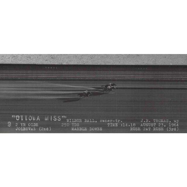 March 1964 black and white photograph of Ottawa Miss in the winner's circle at Marble Downs in Carthage, Missouri. African...