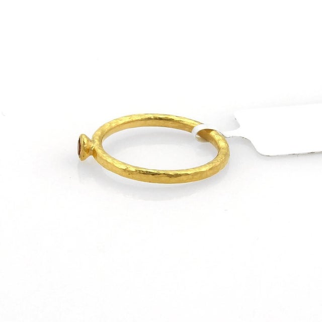 The Gurhan Skittle 24k Gold & Spessartine Hammered Ring in size 5 is a stunning piece of fine jewelry. Made by the...