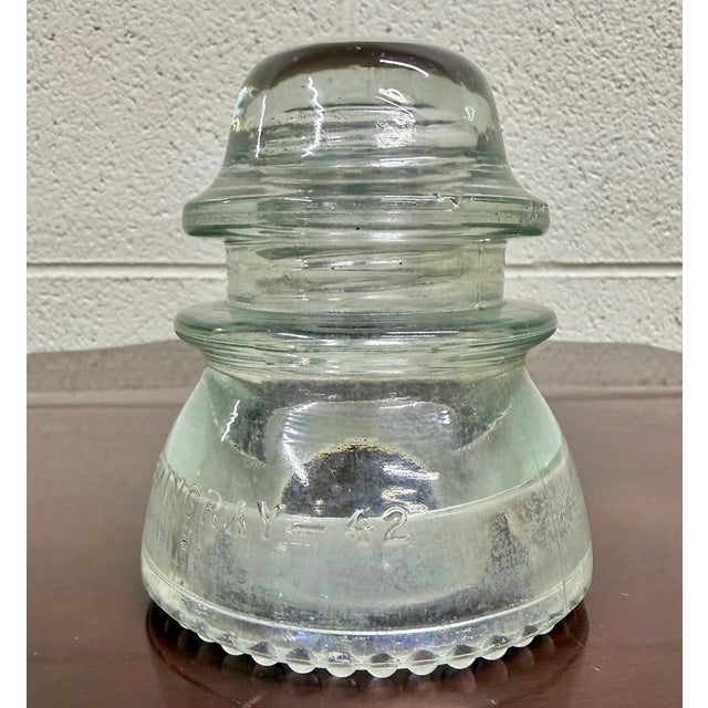 This is an authentic vintage Hemingray No. 42 clear glass electrical insulator, produced for use on telephone, telegraph...