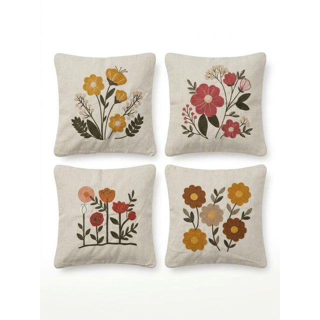 Elevate your interior decor with this exquisite set of four hand-embroidered floral cushion covers sourced from Turkey....
