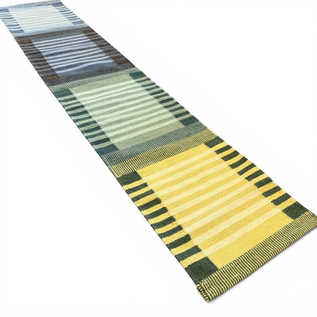 A beautifully balanced handwoven kilim runner with a bold yet refined Scandinavian-inspired color block design. This piece...