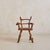 A 1960s French folk art armchair, hand-carved from solid wood with a raw, rustic sensibility. Each limb-like element...