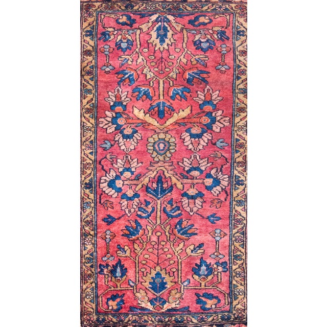 A sweet early 20th century Persian Lilihan rug with a simple mirrored styled floral and scrolling pattern, surround by a...