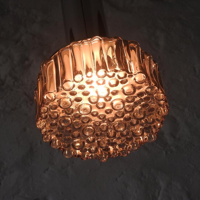 Vintage ceiling lamp with a chromed metal bracket, a slightly smoked bubble glass shade, and an extra-long fabric cable....