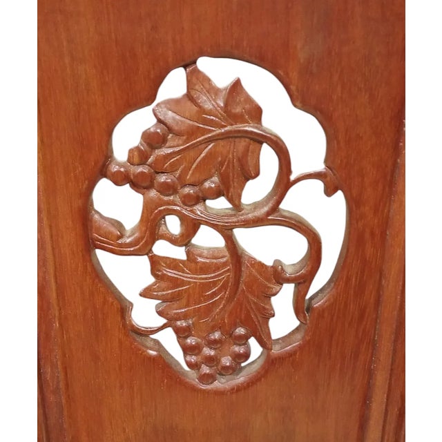 Well-carved restored Rosewood lounge chairs. No maker's mark.