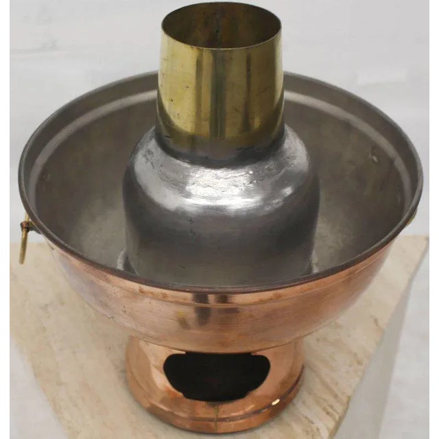 Nice metal craftsmanship fuel pellets food warmer. It works with hook pipe type coal or fuels pellets.