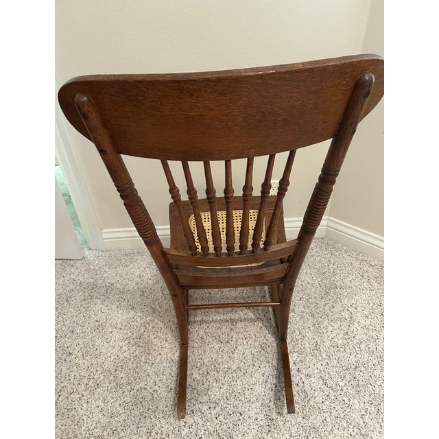 Wood Vintage Hand-Carved Cane Seat Rocking Chair For Sale - Image 7 of 7
