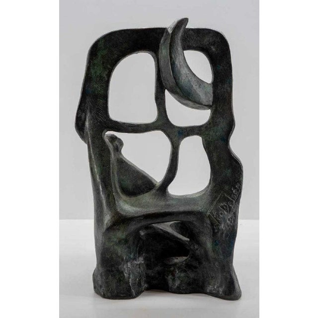 This is a large, heavy bronze sculpture with a verdigris patina. it is signed illegibly. This came from a collection of...