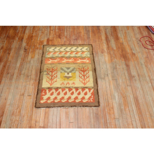 A mid-20th-century wool hand-knotted Swedish Rya plush Rug with an all-over floral design autumn-like colors