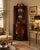 Elegant 19th-century English mahogany corner cabinet featuring classic Georgian-style design and refined decorative...