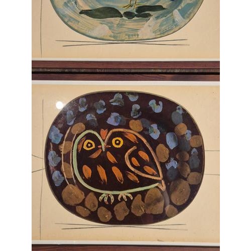 An exquisite collection of twp framed shiny polychrome prints of Picasso Vallauris ceramic plates depicting birds. The...
